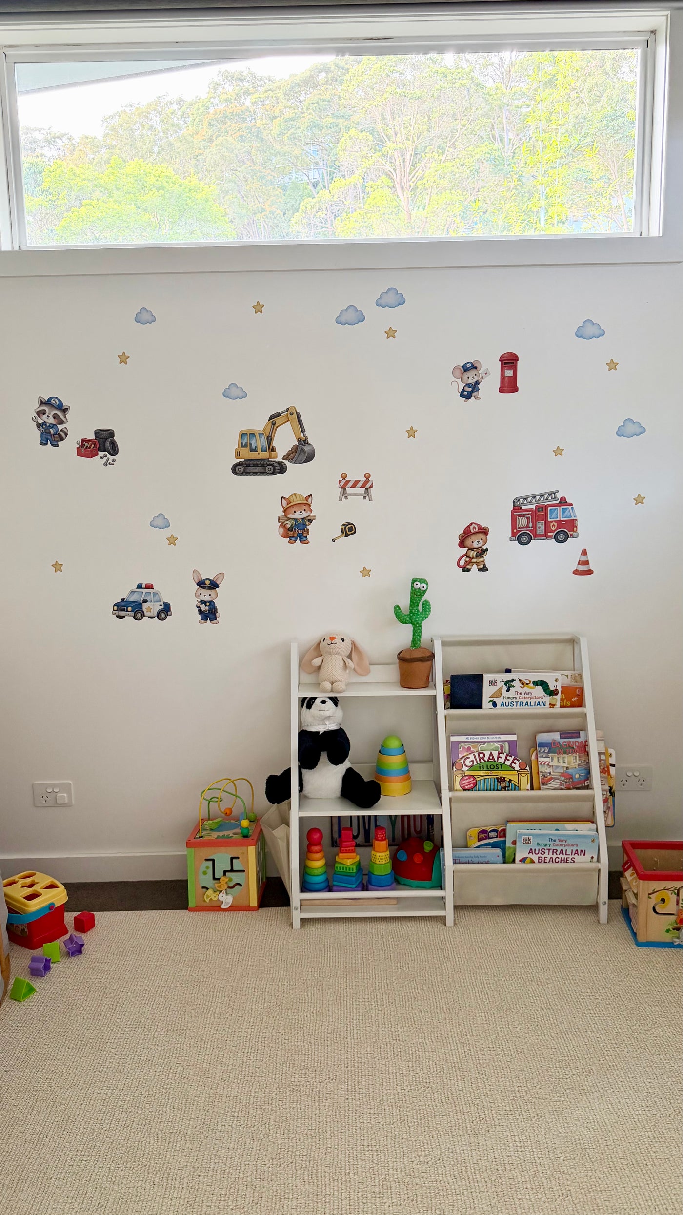 Real kids’ room featuring Everyday Heroes fabric wall stickers, with colourful profession-themed characters decorating the wall.