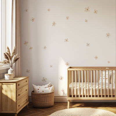 Neutral nursery with Ivory Bloom floral wall decals in soft cream and beige, scattered across the wall above a wooden cot.